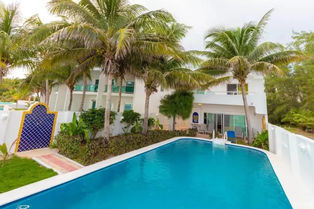 Beachfront Home with 6 Bedrooms, Ocean Views, and Adjacent Development Lot near Puerto Morelos