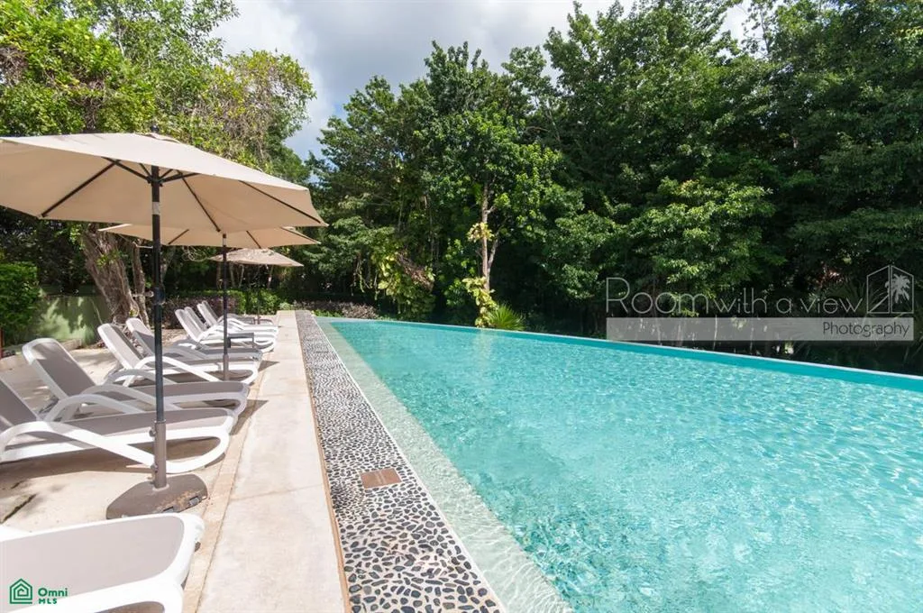 Garden-Level 2-Bedroom Condo with Private Terrace and Resort Amenities in Akumal near Tulum