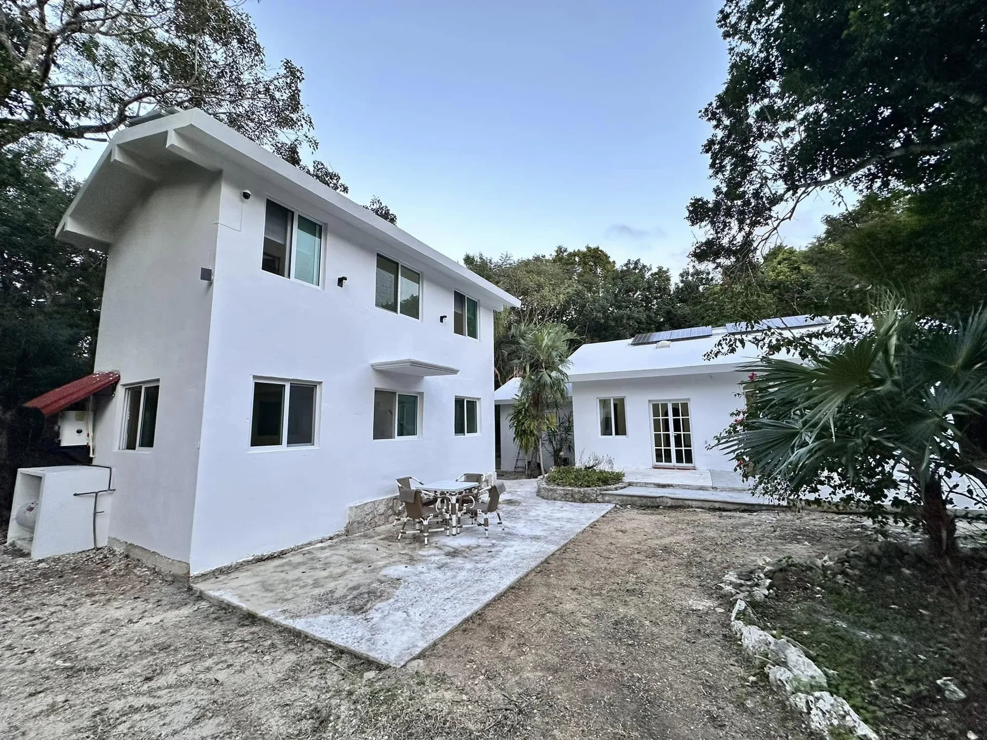 Residential Land with Two Homes in Puerto Aventuras: 2. 5-Acre Estate Featuring Private Cenote and Solar Power