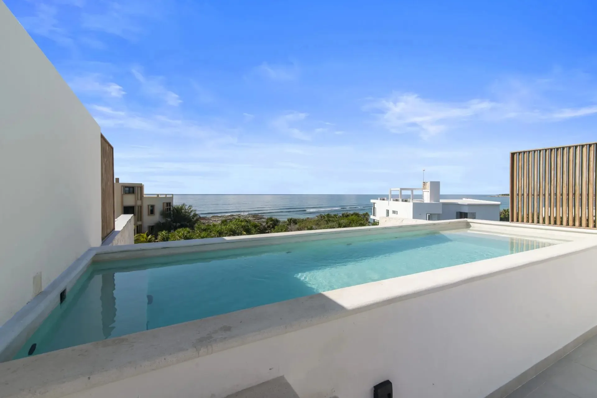 Two-Level Penthouse Condo with Dual Terraces, Private Rooftop Jacuzzi, and Ocean Views near Beach Club