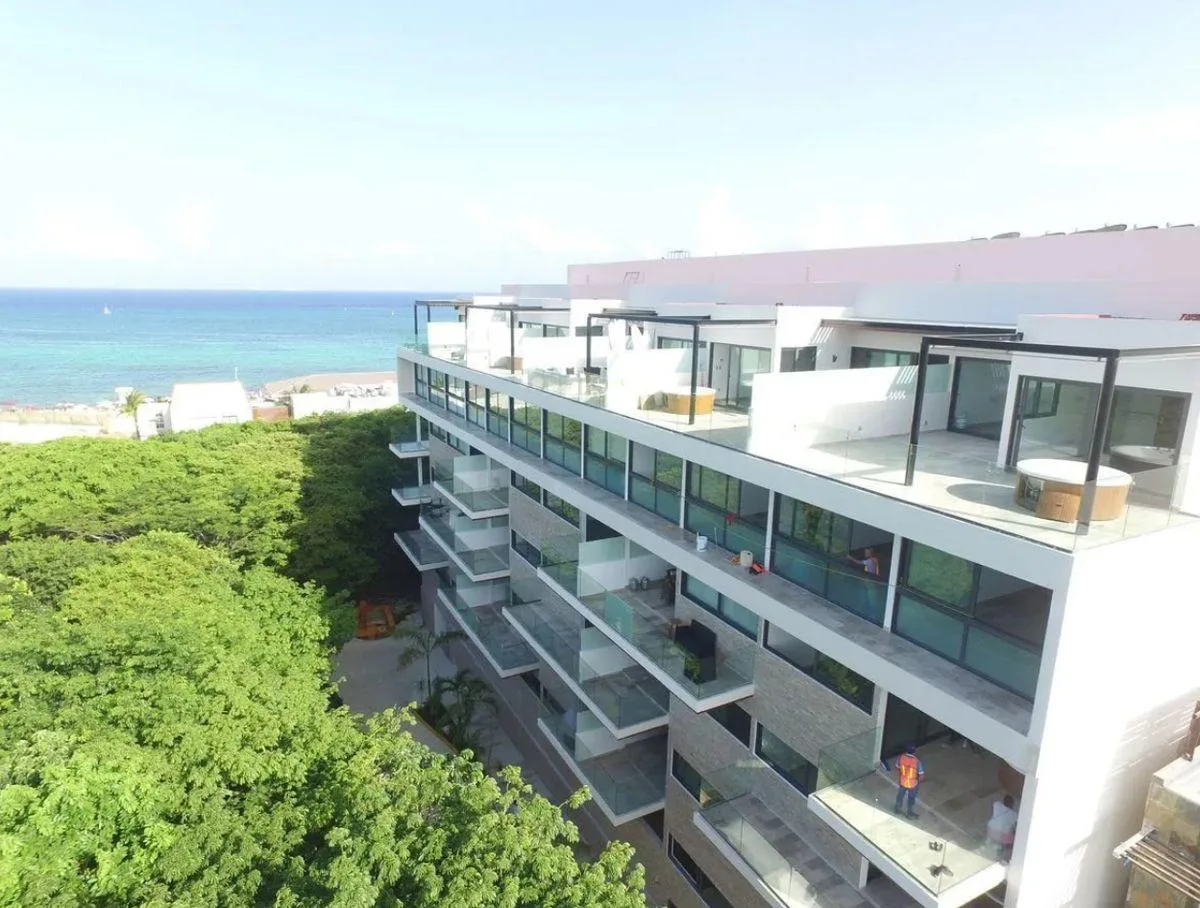 Beachfront 2-Bedroom Condo with Rooftop Pool in Playa del Carmen's Mamitas Area