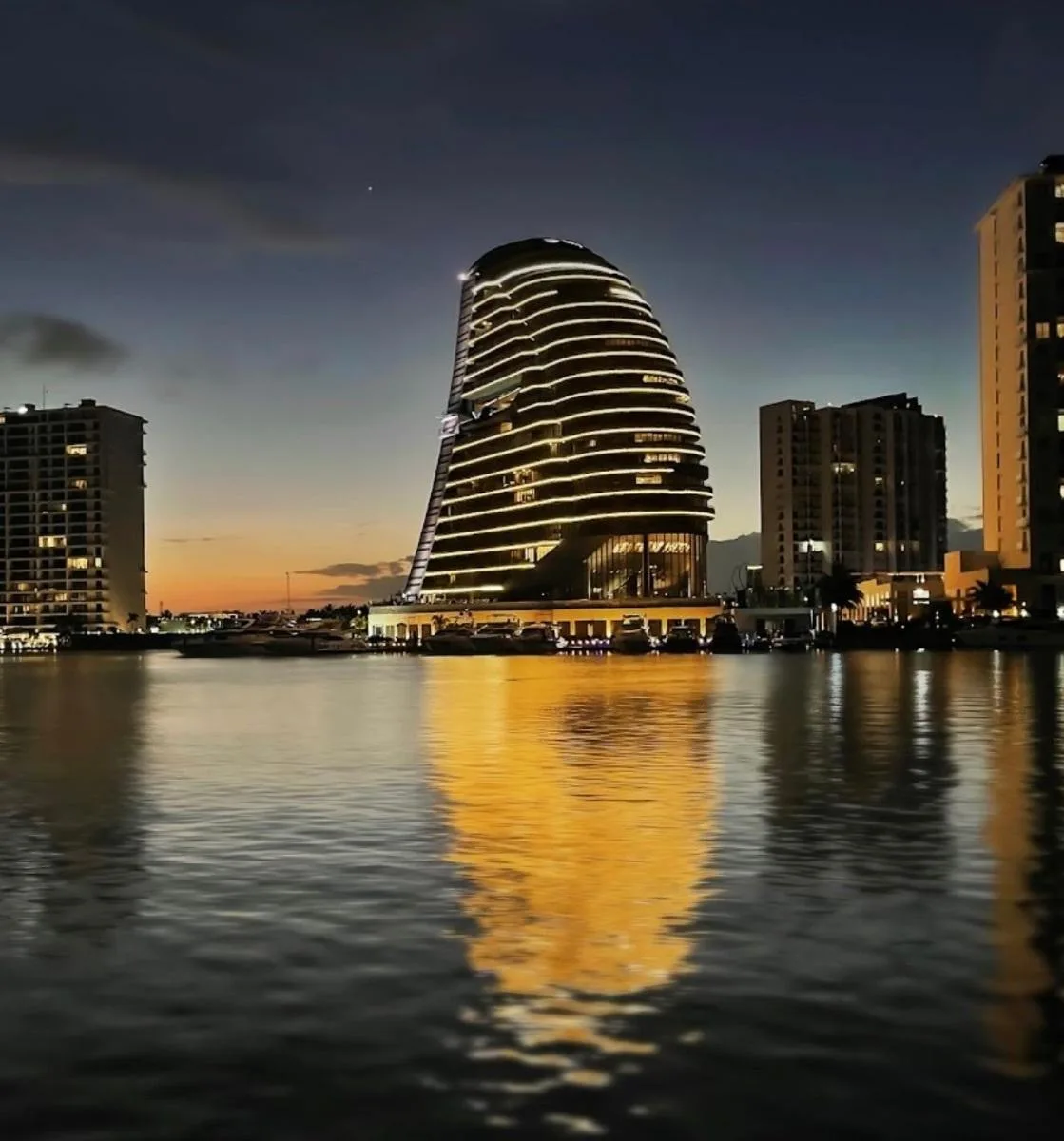 Seventh-Floor Three-Bedroom Apartment with Wraparound Terrace and Marina Views in Puerto Cancun's Shark Tower