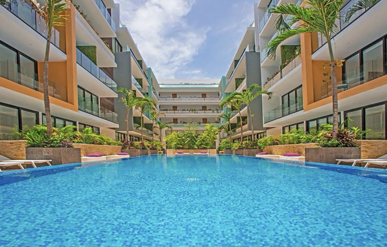 1-Bedroom Condo in Menesse The City, Playa del Carmen - Open-Concept Layout with Private Terrace and Resort Amenities