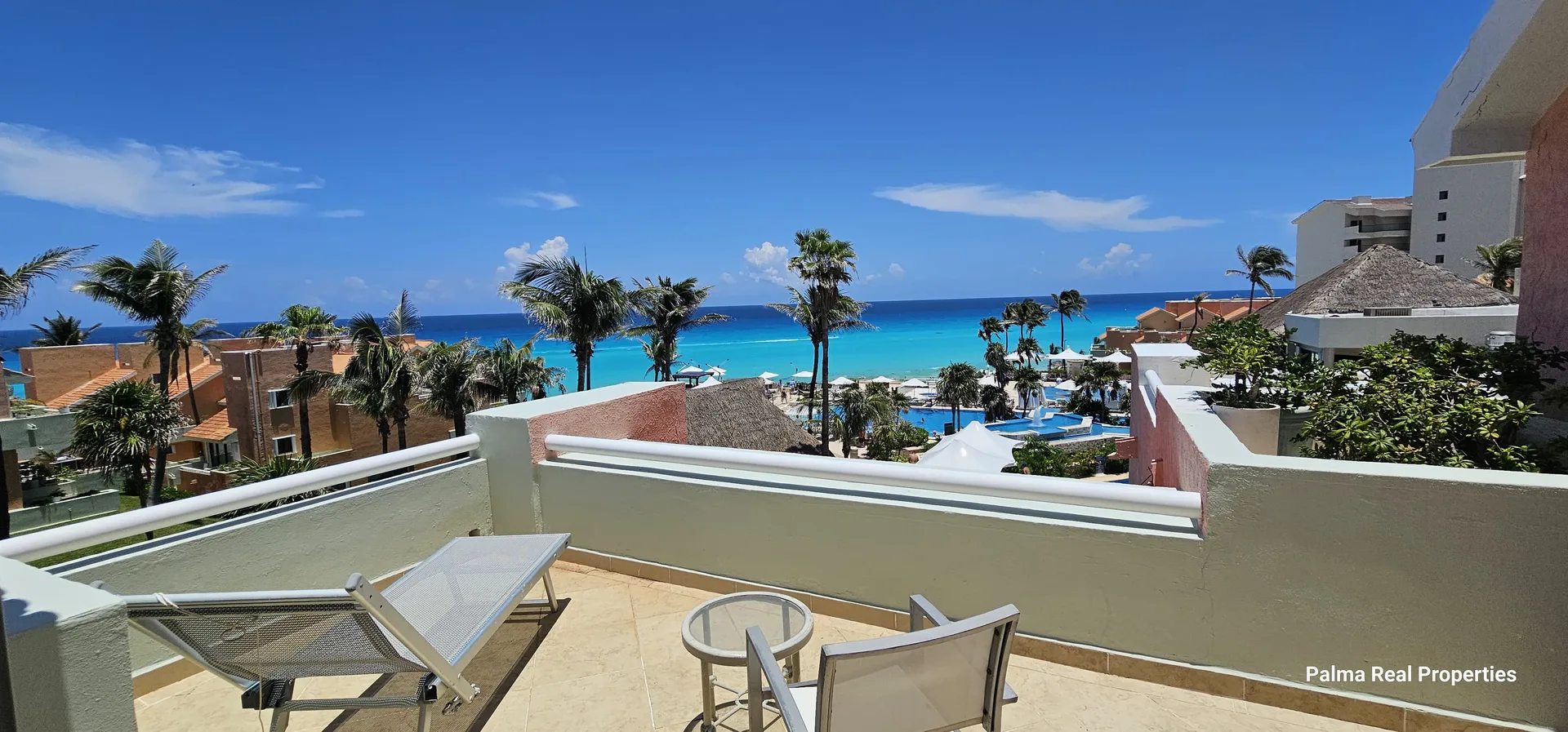 Renovated Three-Bedroom Beachfront Villa with Ocean-View Terraces and Pool Access